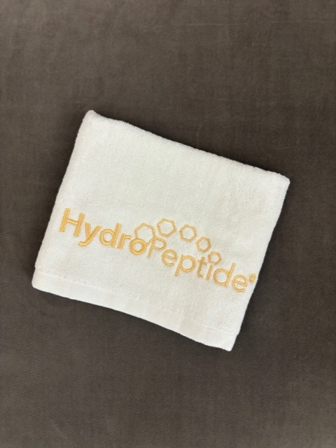 Darček Malý bavlnený uterák Hydropeptide biely so zlatou výšivkou 35x35 cm<br>Towel Hydropeptide small white, golden sign 